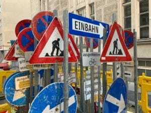 blue white and red arrow sign